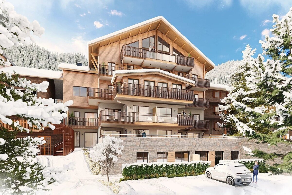 A modern wooden chalet in a snowy mountain landscape, surrounded by snow-covered pine trees under a clear blue sky.