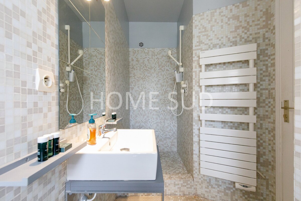 A bathroom with the word home on the wall
