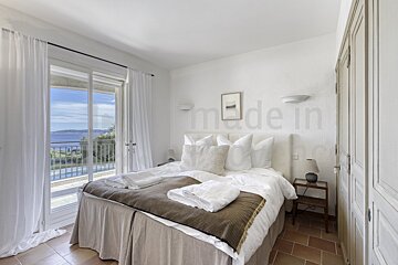 A bedroom with the word made in on the wall