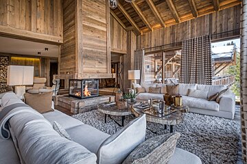 A living room filled with furniture and a fireplace