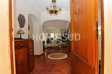 The word home is on the door of a house