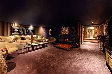 A living room with a picture of franklin d. roosevelt on the wall