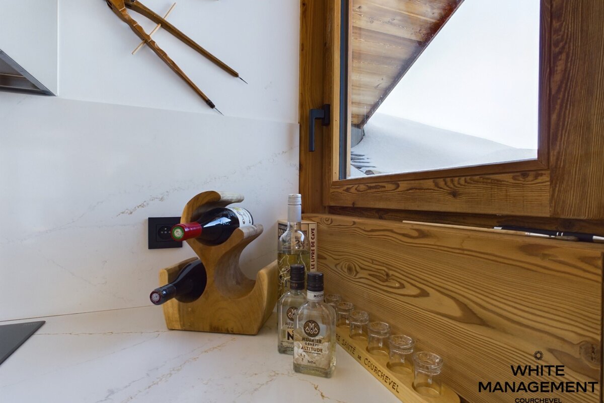 A bedroom with two beds and a flat screen tv