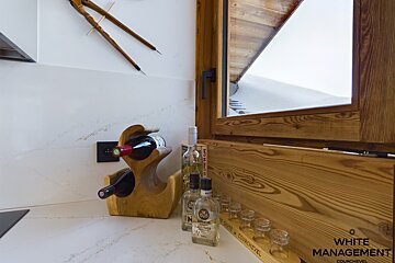 A bedroom with two beds and a flat screen tv