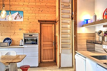 A kitchen with a sign that says aloha on it