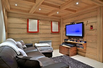 A living room with a couch and a flat screen tv