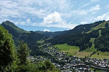 A large wooden building with a sign that says