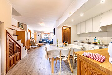 A kitchen with a bottle of clorox on the counter