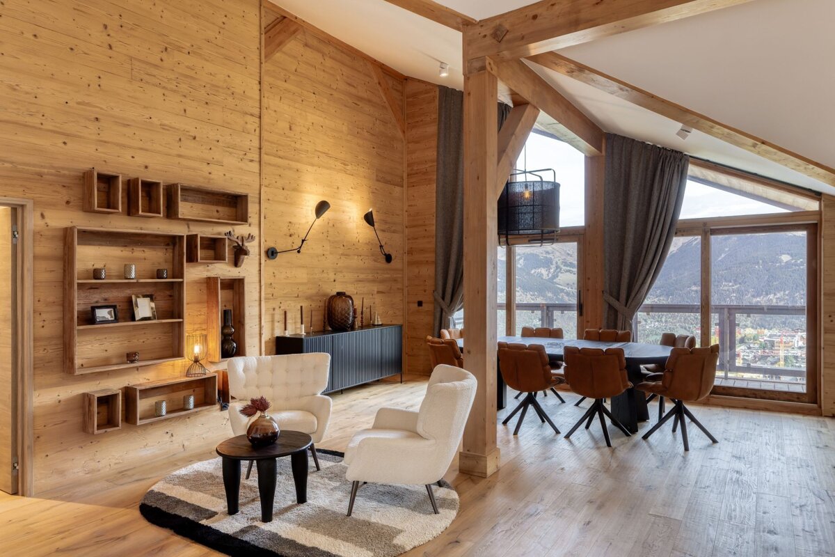 A living room with a dining room table and chairs