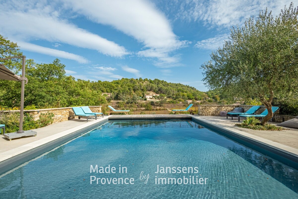 A large swimming pool with the words made in provence by immobilier on the bottom