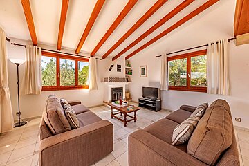 A living room with two couches and a television