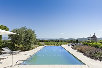 A large swimming pool with the words luxury experiences on the bottom