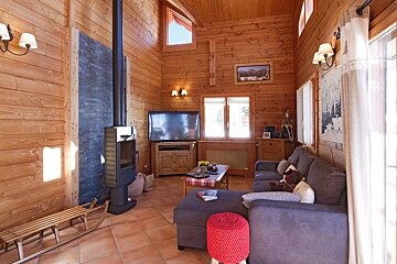 A living room with a couch and a television