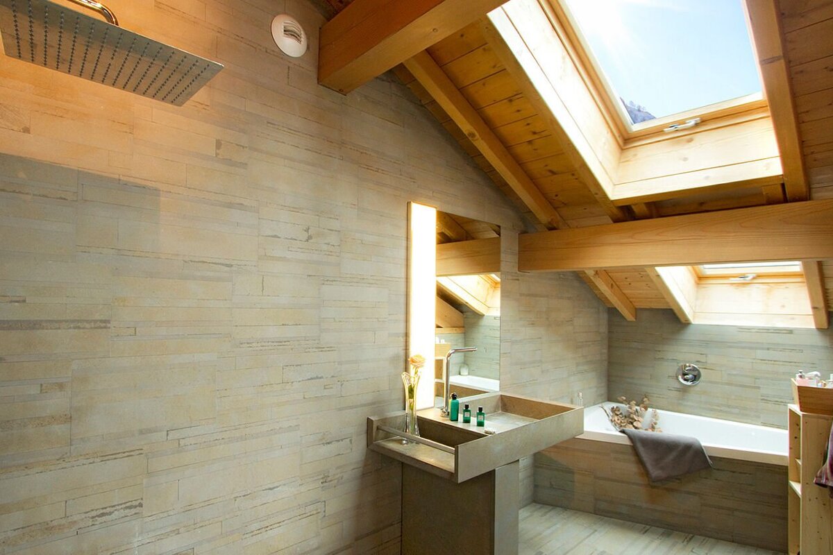 A bathroom with a skylight above the sink
