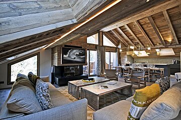 A living room with a couch and a flat screen tv
