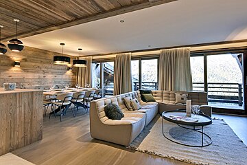 A living room with a couch and a coffee table