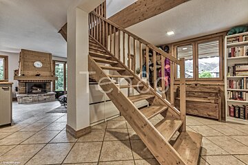 A wooden staircase leading up to the second floor of a house
