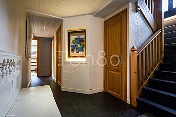 A photo of a hallway with the number 80 on the bottom