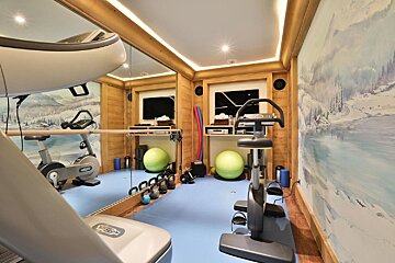 A gym with a machine that says technogym on it