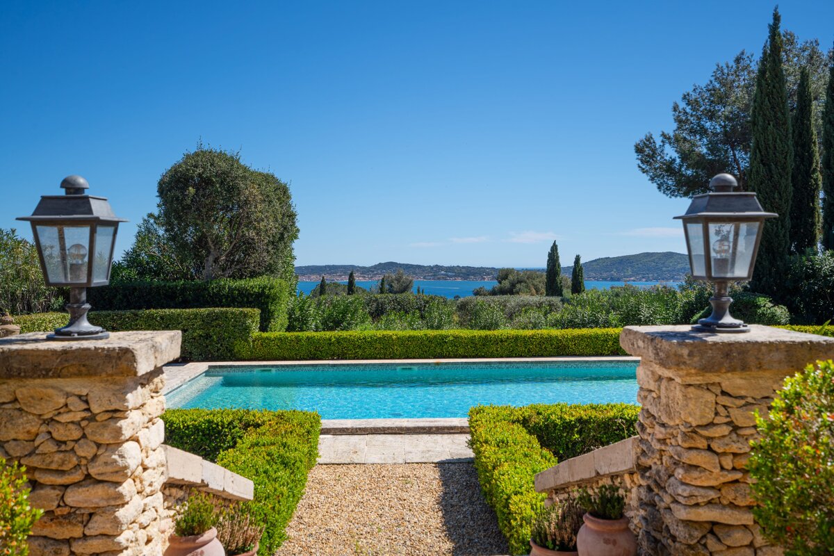 A swimming pool with a view of a body of water