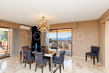 A dining room with the word home on the wall