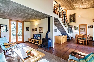 A living room with a fireplace and a flat screen tv