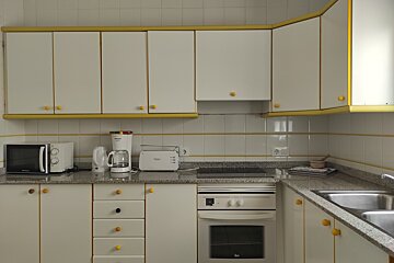 A kitchen with a toaster and a coffee maker