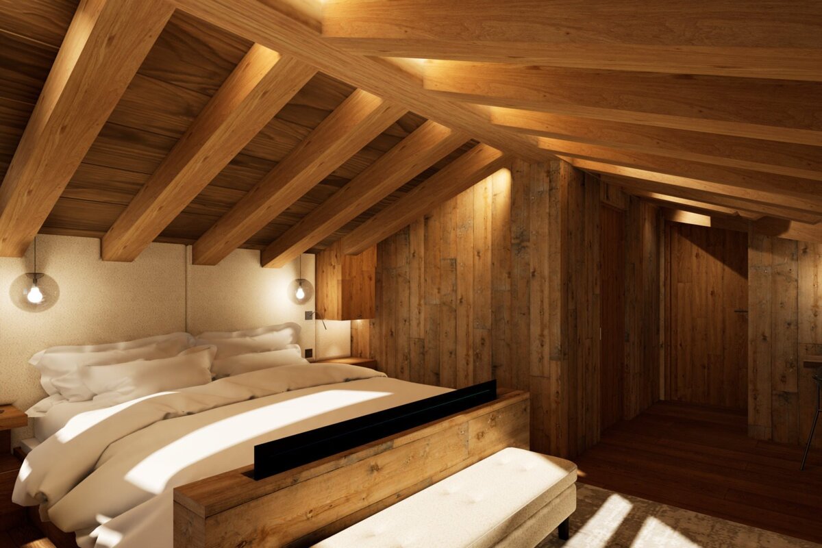 A bedroom with a wooden ceiling and a bed