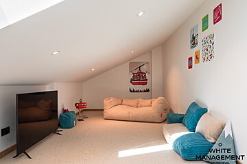 A bathroom with a toilet a sink and a mirror