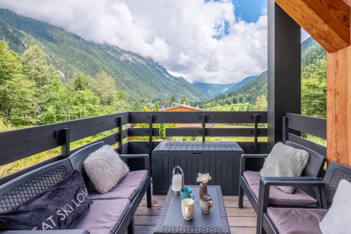 A balcony with a couch that says eat ski low