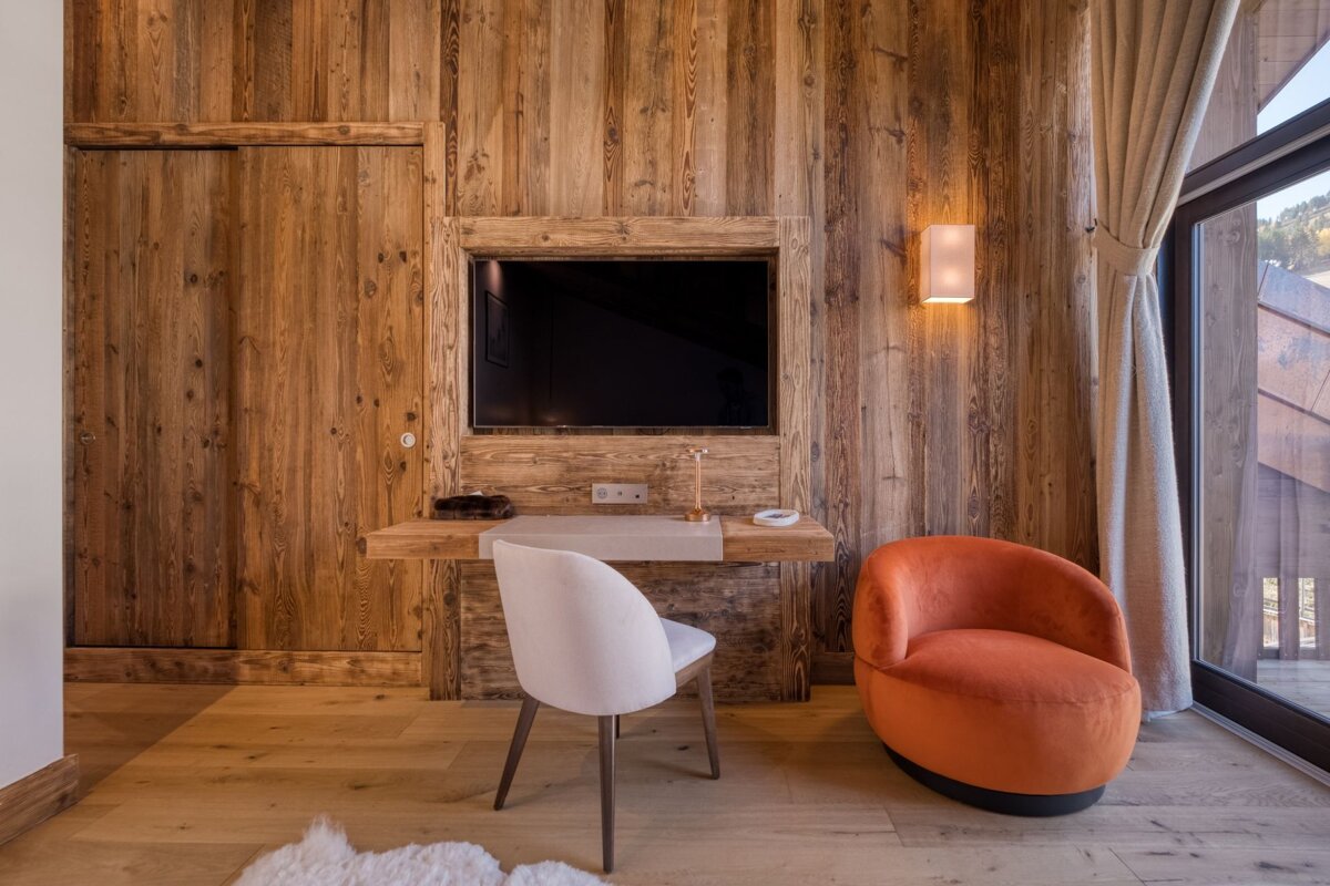 A wooden wall with a tv mounted on it