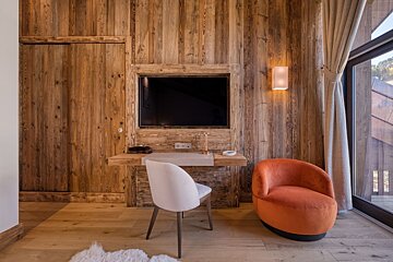 A wooden wall with a tv mounted on it