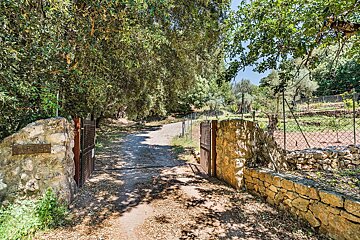 A stone wall with a sign that says ' a ' on it