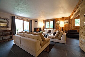 A living room filled with furniture and a fireplace