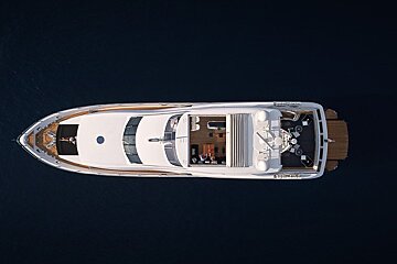 An aerial view of a large white yacht in the ocean