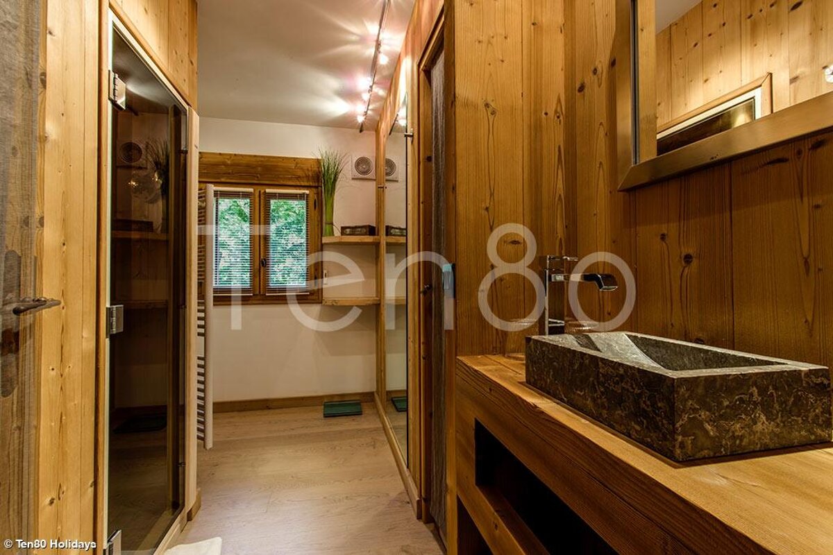 A bathroom with a sink and a sign that says ten80 holidays