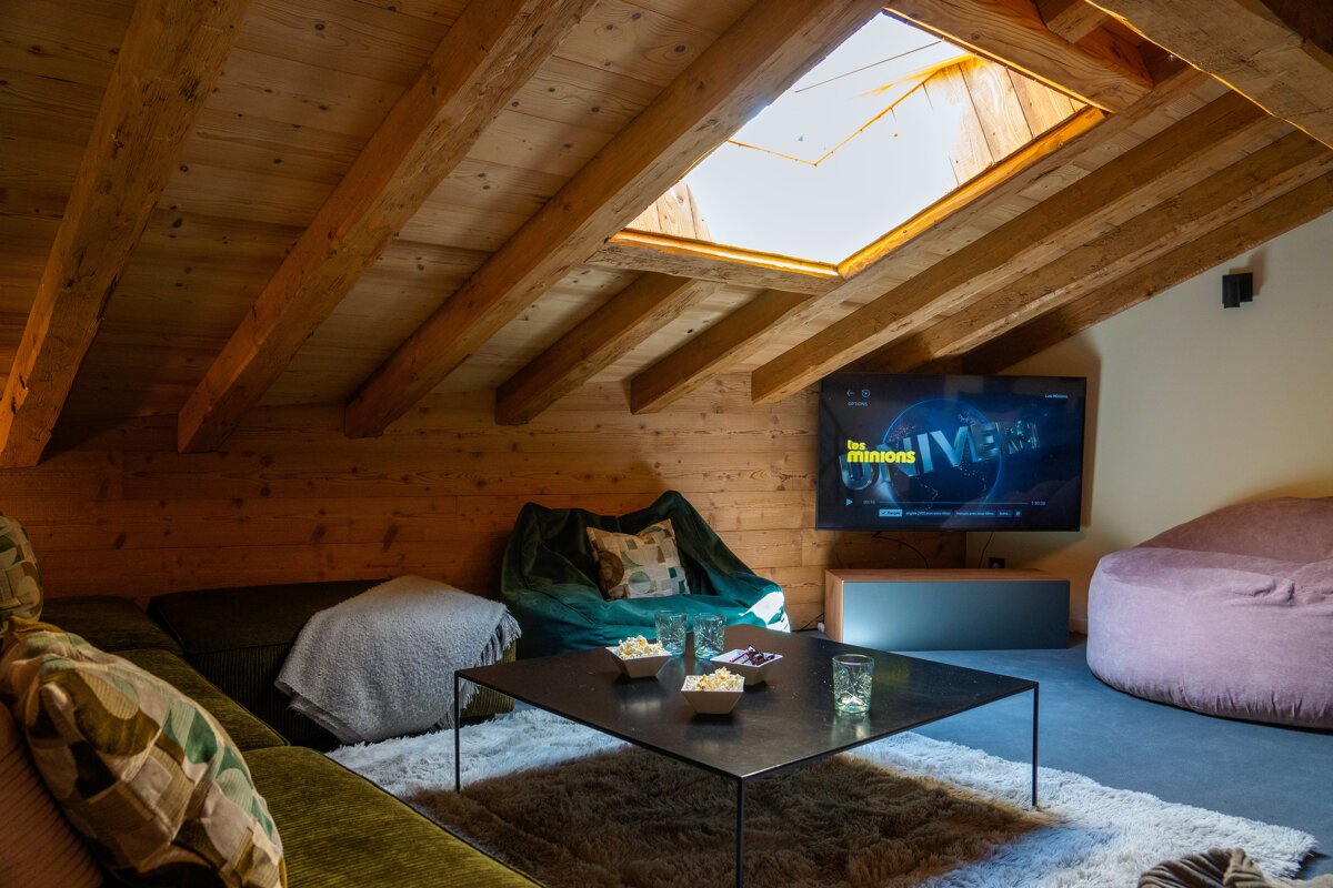 A living room with a flat screen tv showing the minions