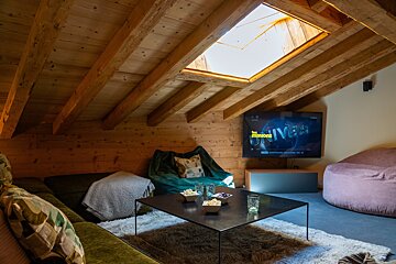 A living room with a flat screen tv showing the minions