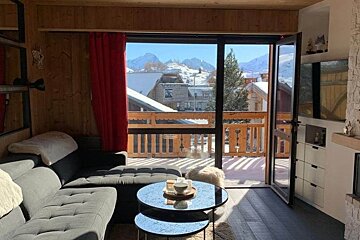 A living room with a couch and two coffee tables