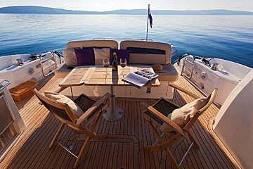 A boat with a table and chairs in the water