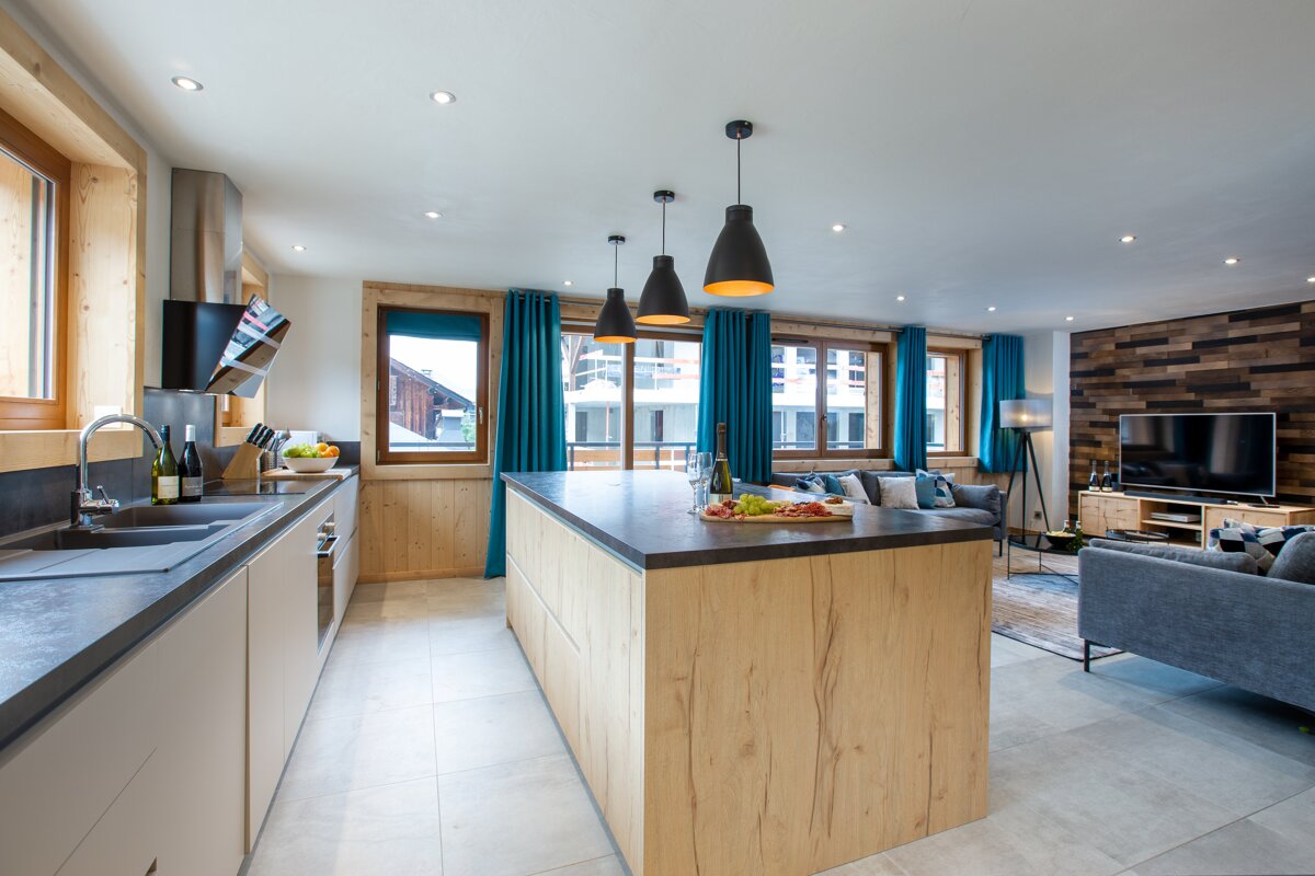 A kitchen with a large island in the middle of it