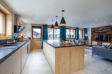 A kitchen with a large island in the middle of it