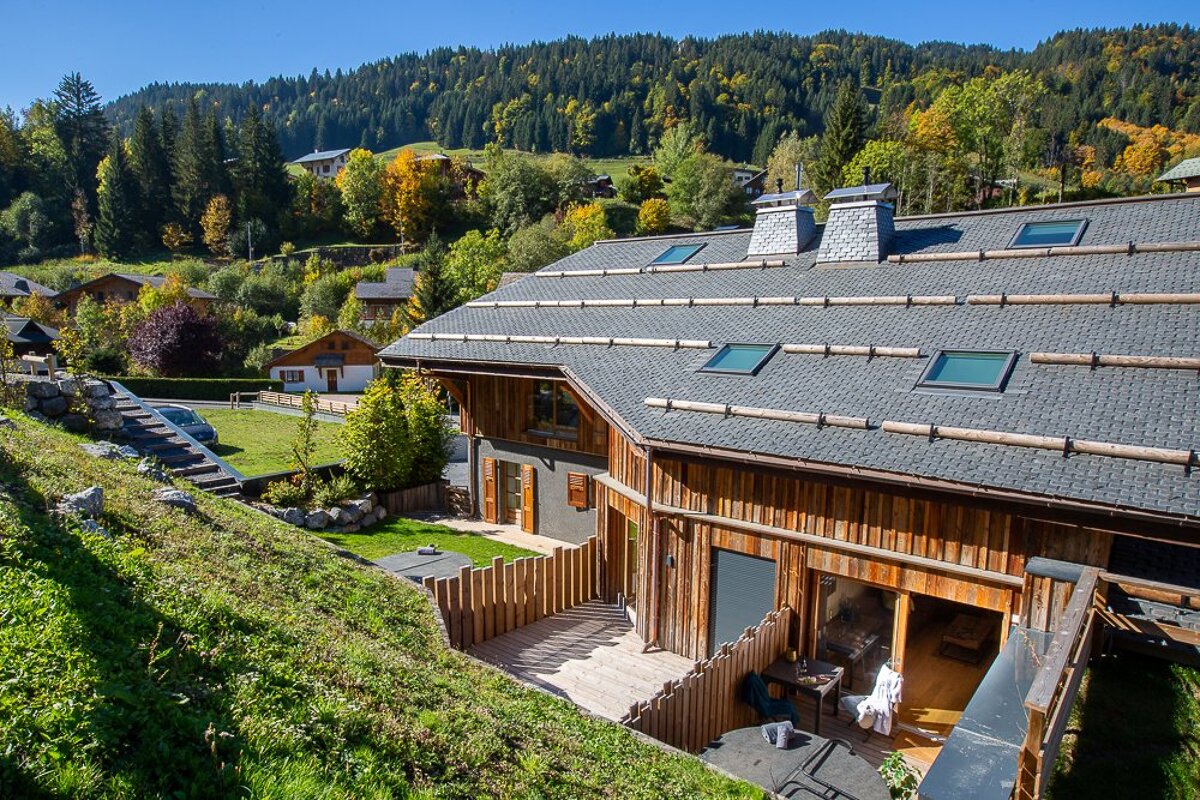 A house with a roof that has a lot of windows