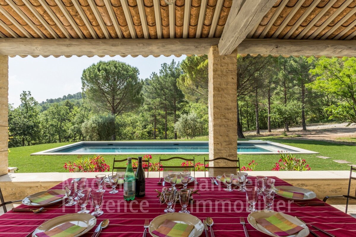 A table with plates and wine glasses and the word provence on it