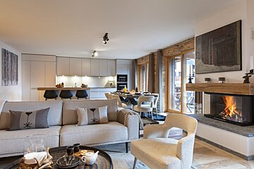 A living room with a fireplace and a couch