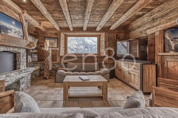 A living room with a couch and a television and the word ten80 on the ceiling