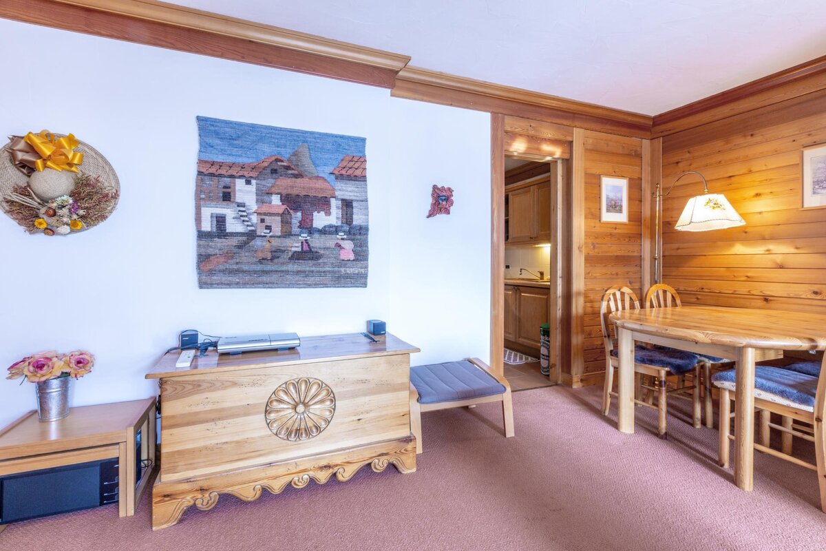 A view of a snowy mountain range from a balcony