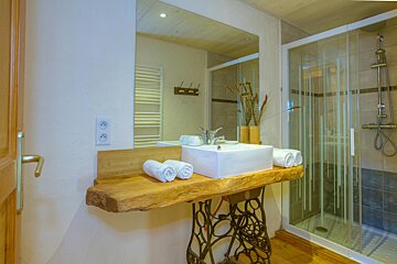 A bathroom with a sink made out of a sewing machine