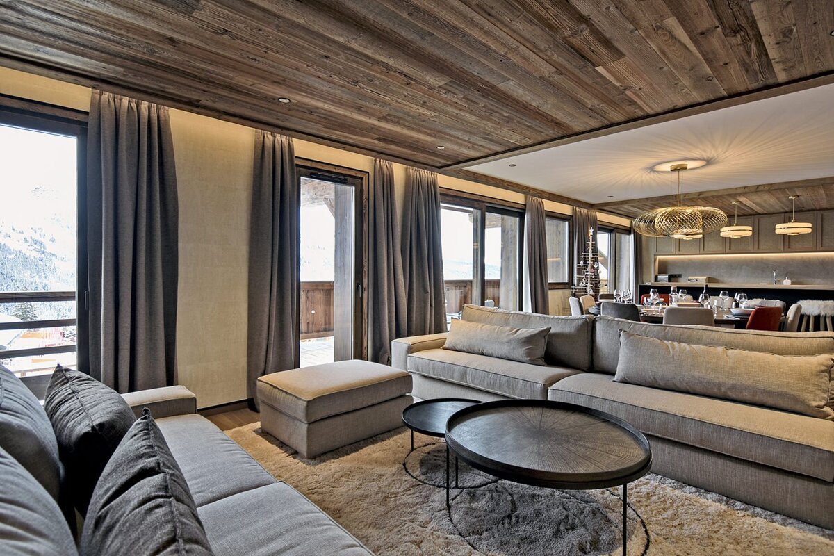 A living room with a couch and two tables