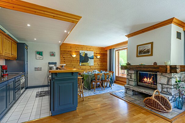 A living room with a fireplace and a table